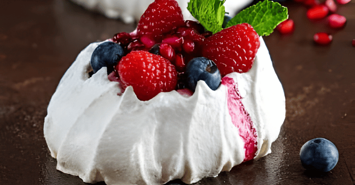 Slice of pavlova served on a dessert plate